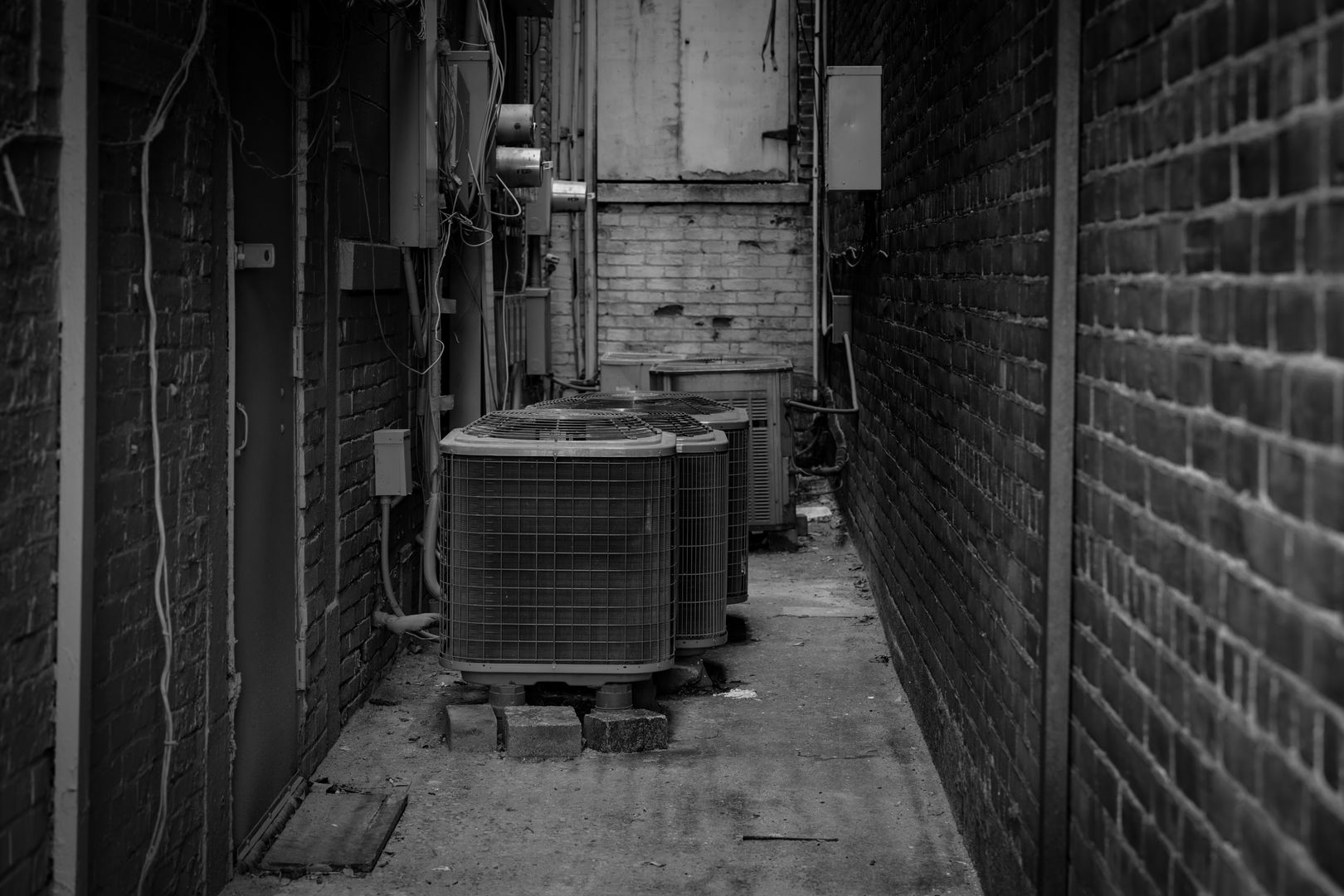 Air-source heat pump outdoor unit next to a UK home wall